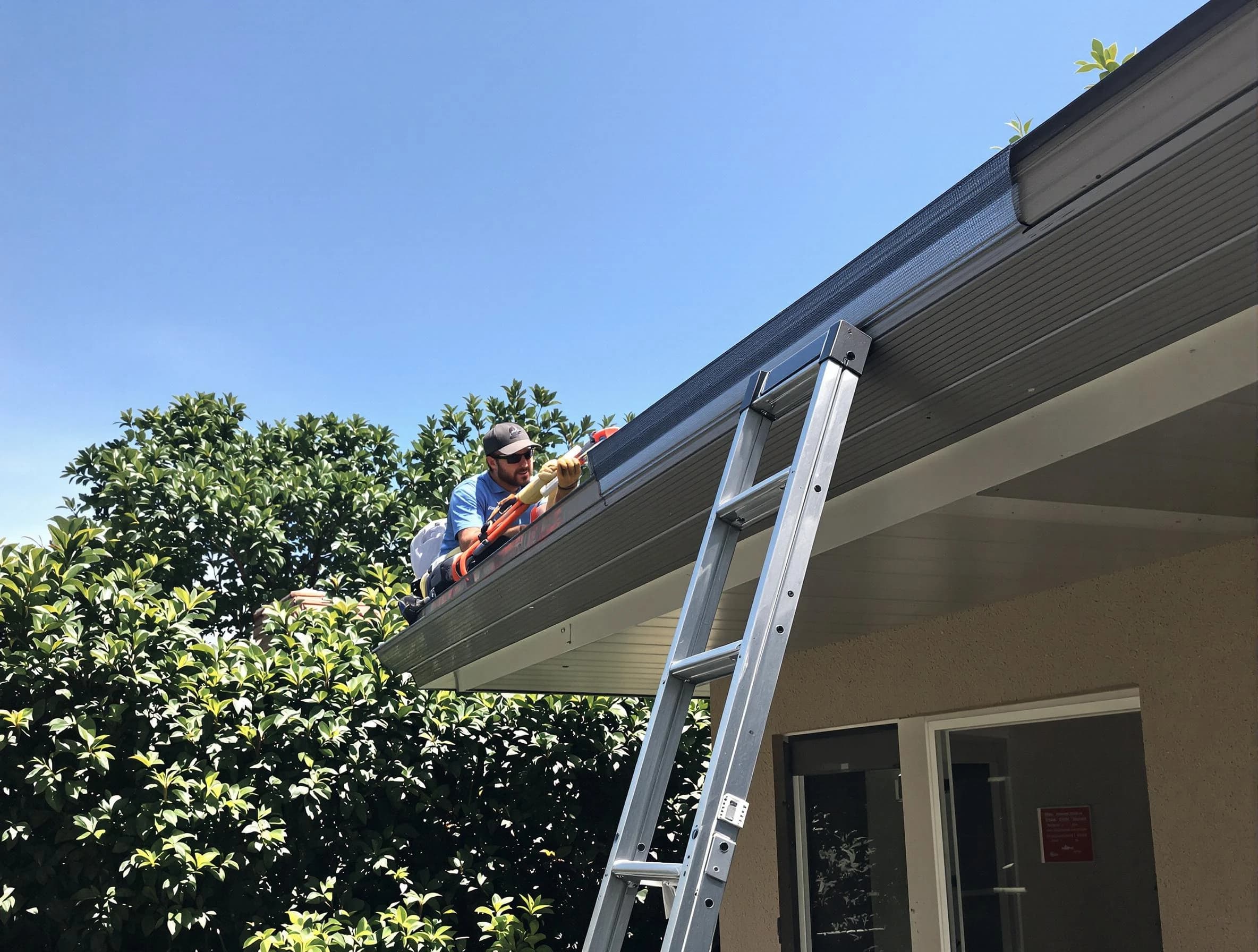 Aurora Roofing Company installing gutter guards for a homeowner in Aurora, OH